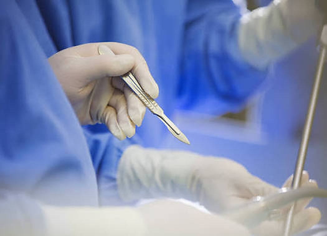 Close-up of medical professionals using surgical instruments